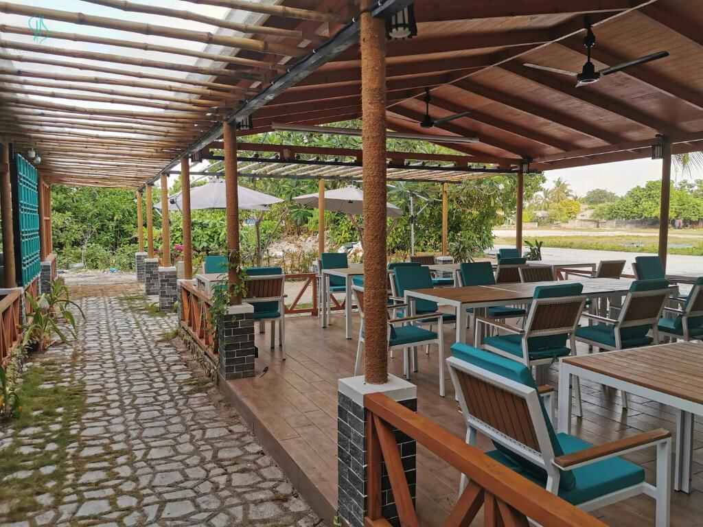 Open-air restaurant terrace at Village Hideaways & Spas, Fulhadhoo