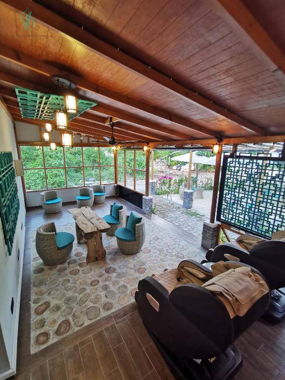 Spa lounge and relaxation area with massage chairs at Village Hideaways & Spas
